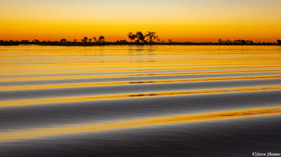 Botswana-Okavango Rippled Sunset
