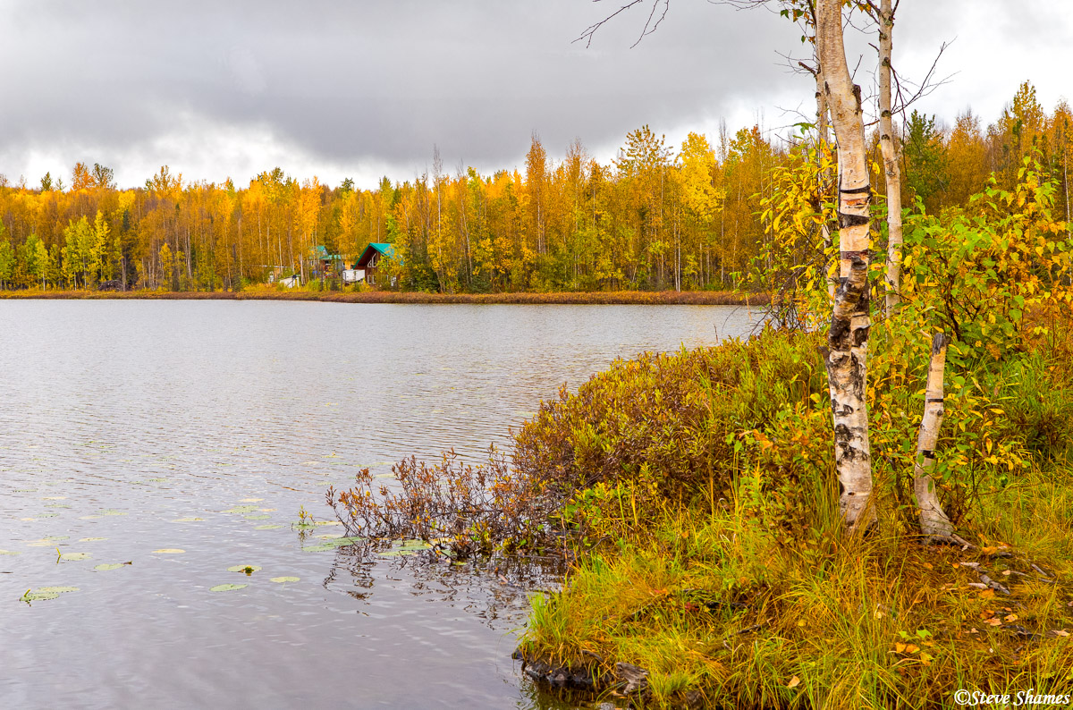 There are countless lakes and ponds and rivers and streams in Alaska. I do not know the name of this one. I thought this house...