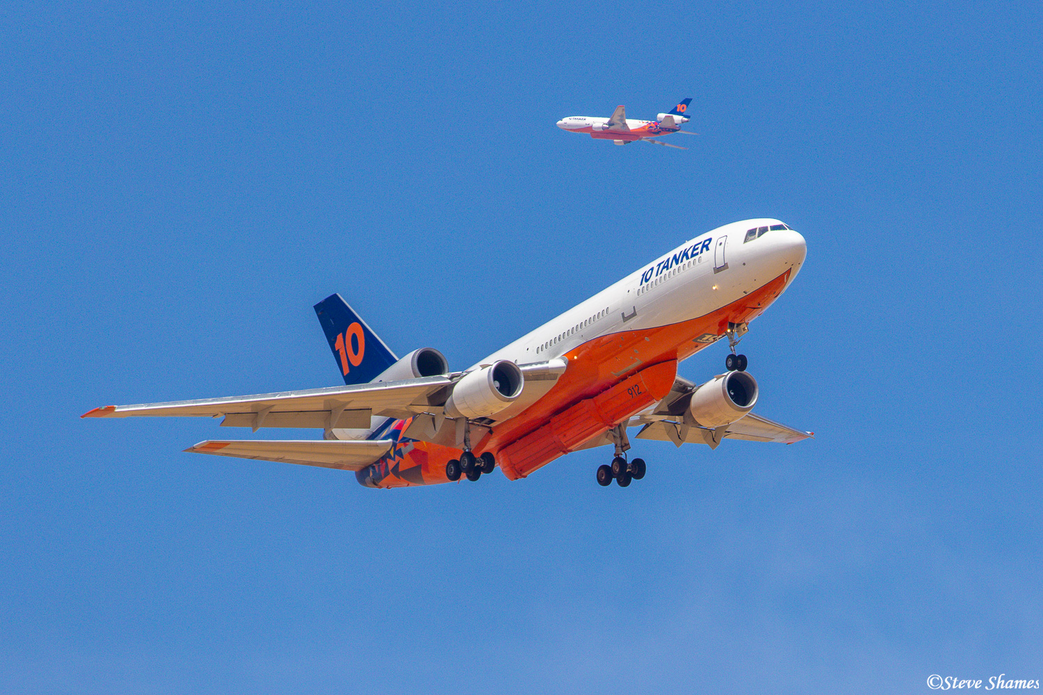 This one shot represents the busy time the air tankers have during the fire season. One plane is coming down to refill, while...