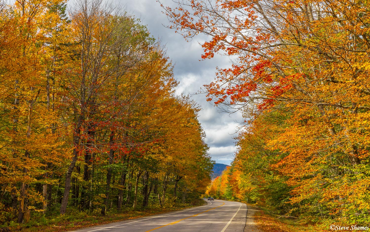 Driving along the scenic Kancamagus Highway in New Hampshire.