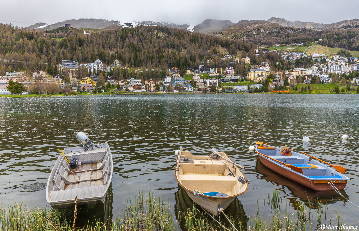Along the shore of Lake St. Moritz. I like the boats with the town on the distant shore. St. Moritz is a scenic town.