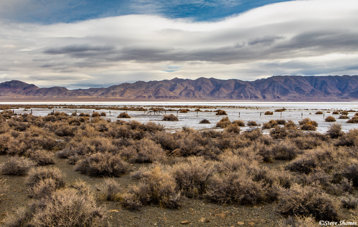 A typical Nevada scene -- an alkaline ancient lake bed with distant mountains.