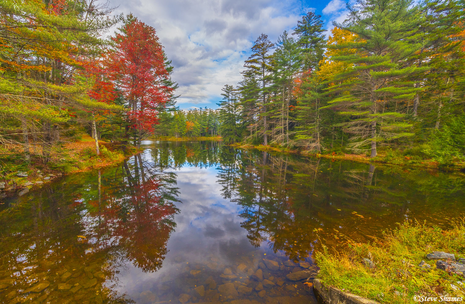 Fall foliage scene at Lowell Lake State Park in Vermont.