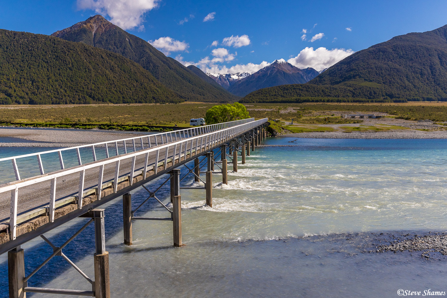 A scene taken from the Tranzalpine Train heading to the Southern Alps. The train had an open car, and was going slow enough to...