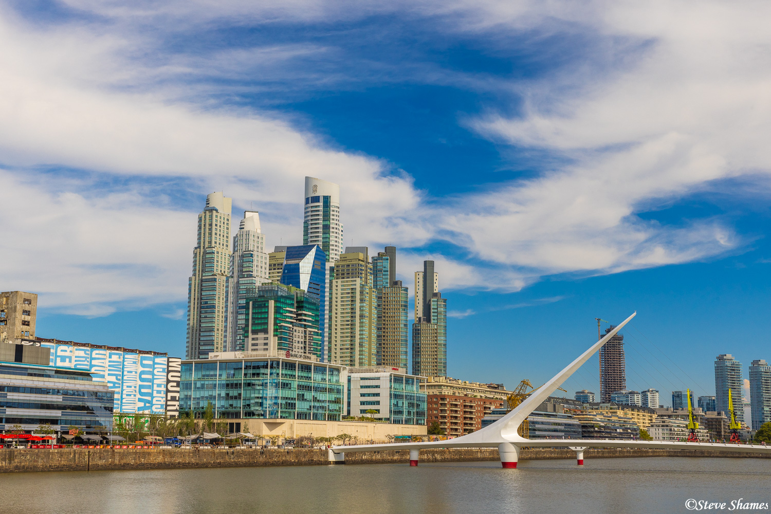 A beautiful sky and the Buenos Aires skyline with the Puente de la Mujer in front. That translates to "Woman's Bridge"