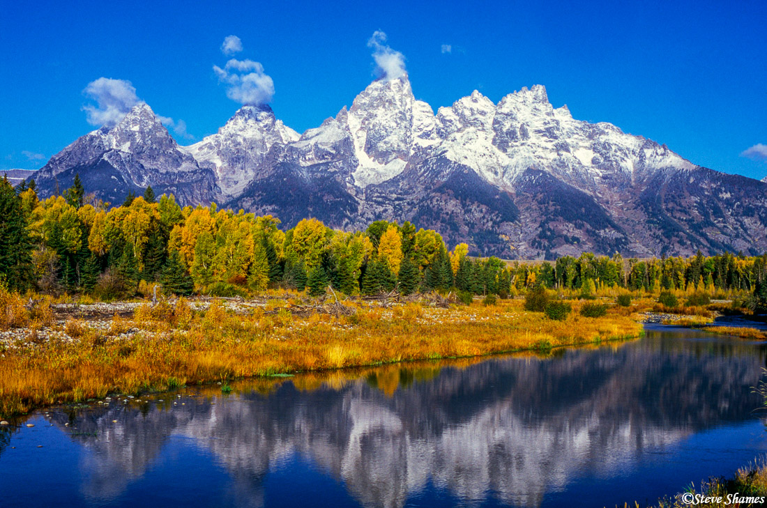 I like the way the little clouds flirt with the peaks. This was at Schwabacher Landing.