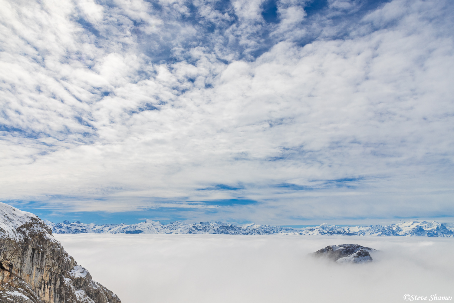 Swiss Alps view from Mt. Pilatus above a sea of clouds. Luckily, the skies cleared for about an hour above the low clouds, and...