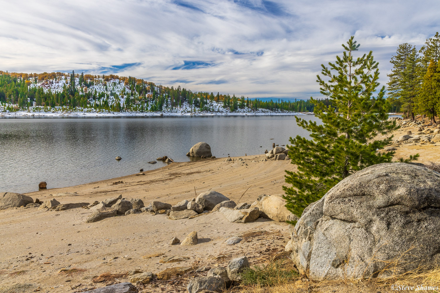 On the shore of a scenic Sierra lake.