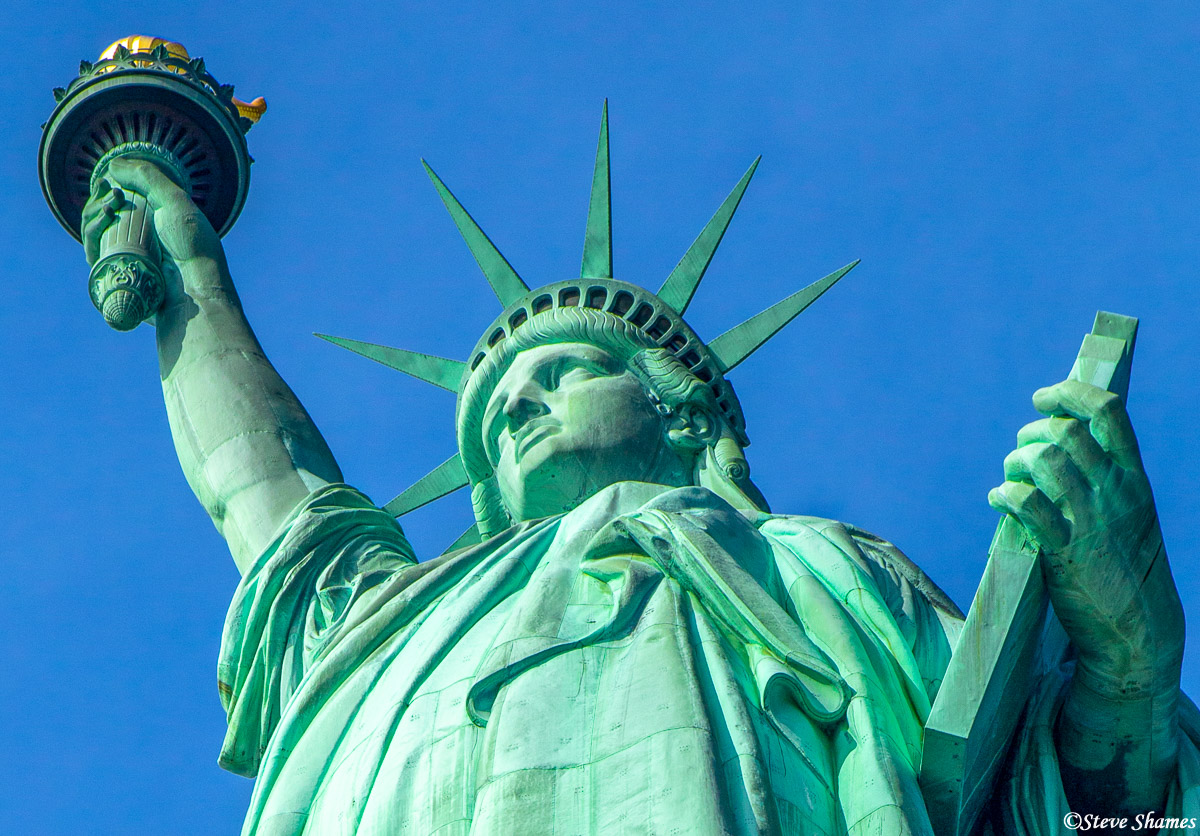 Looking up from below at lady liberty.