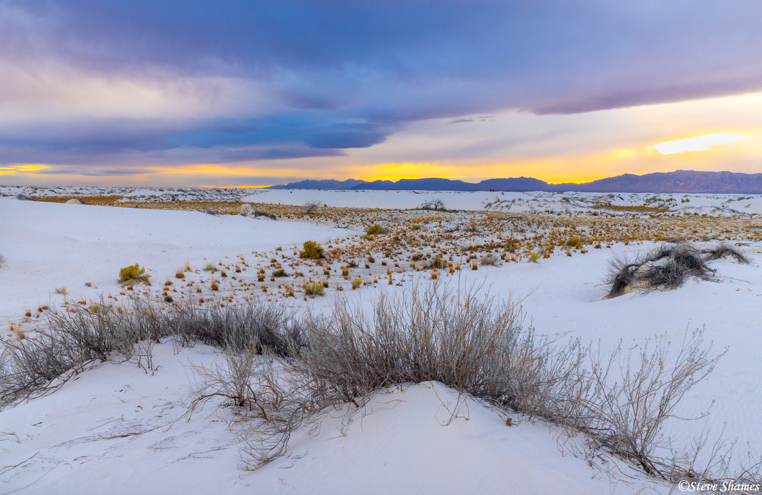 A colorful sky over the landscape of White Sands.
